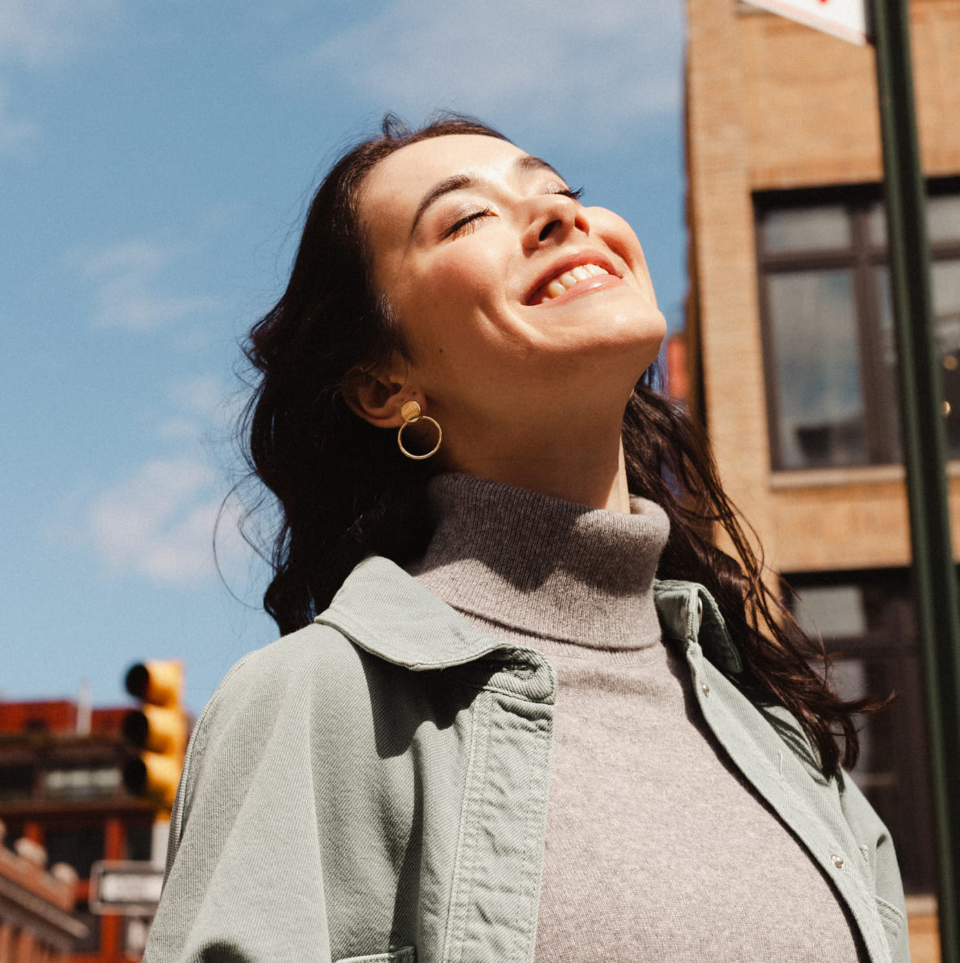 smiling, looking up at sky