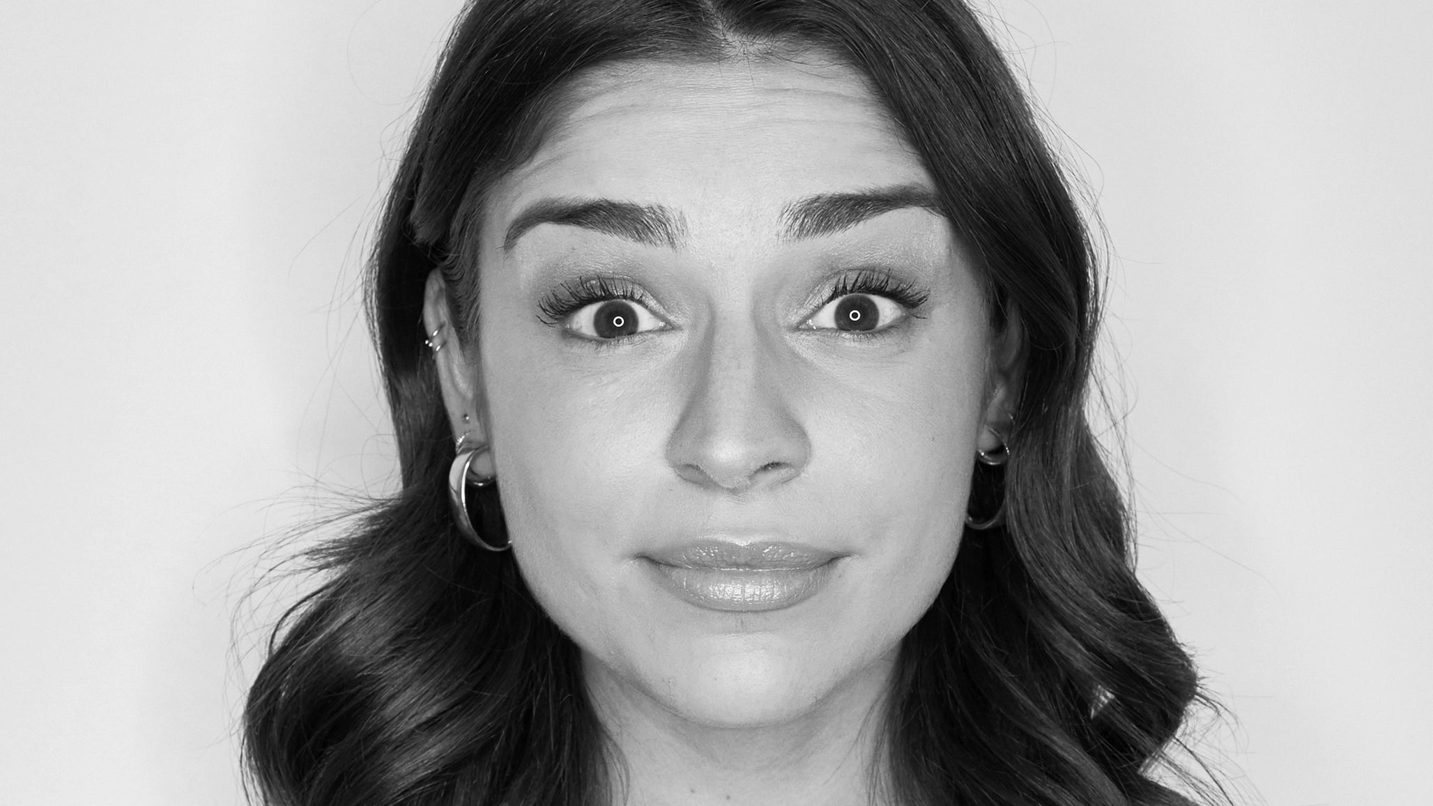 Woman raising eyebrows to show Forehead Wrinkles