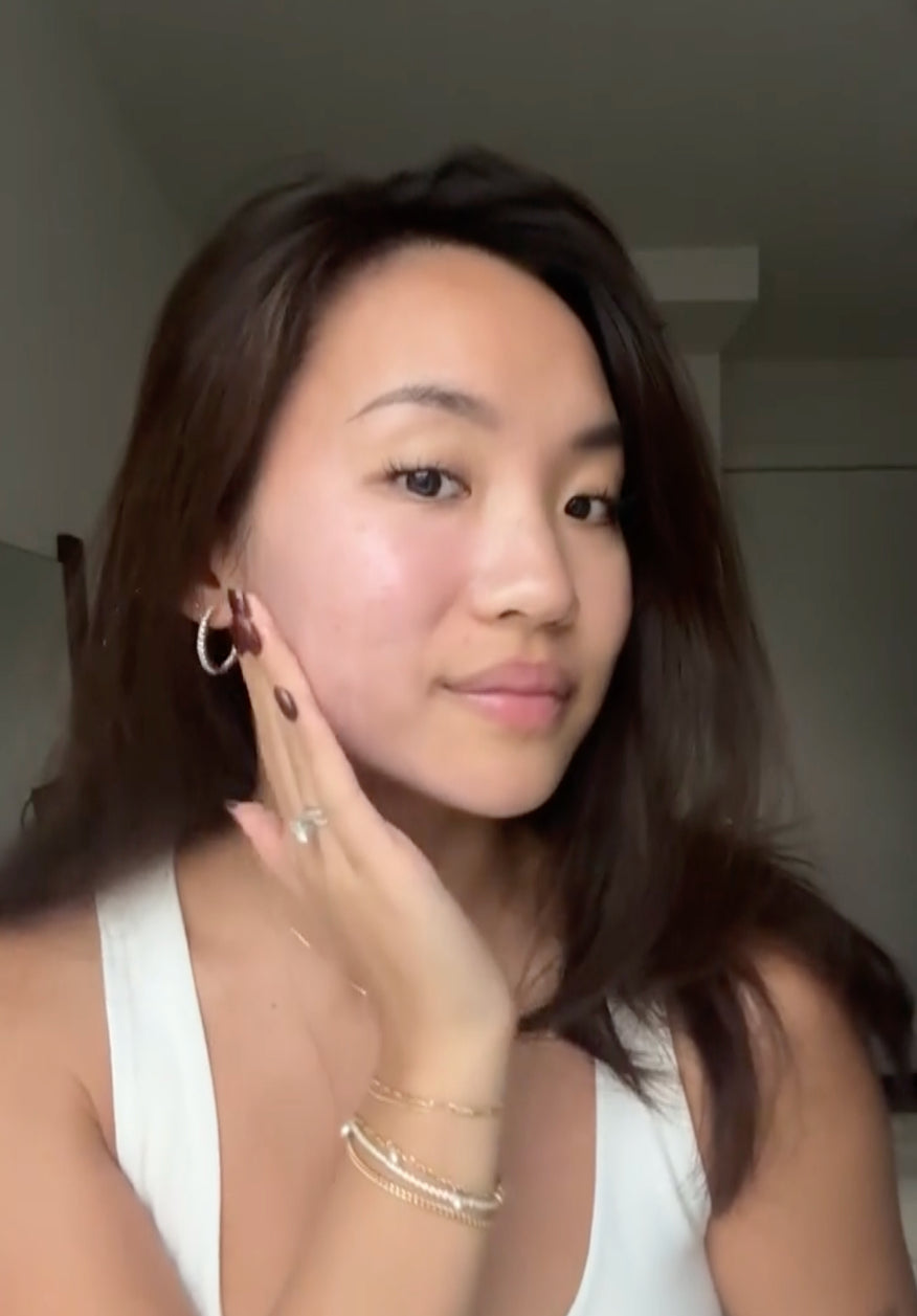 Woman touching her cheek