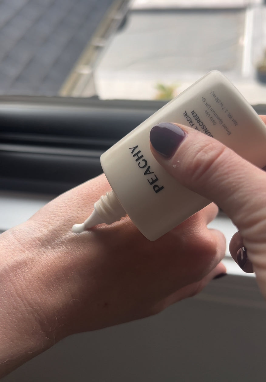 Applying sunscreen to hand