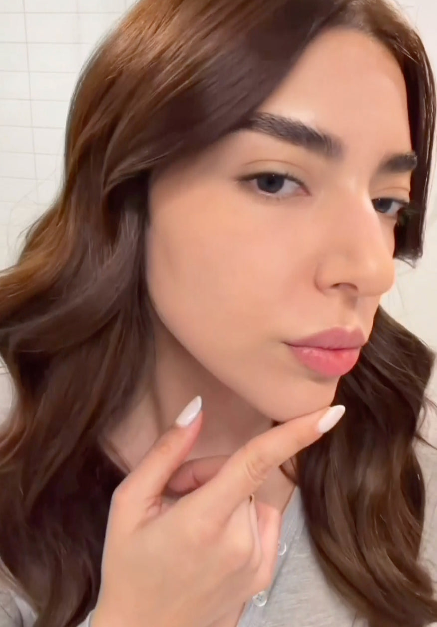 Woman touching her chin