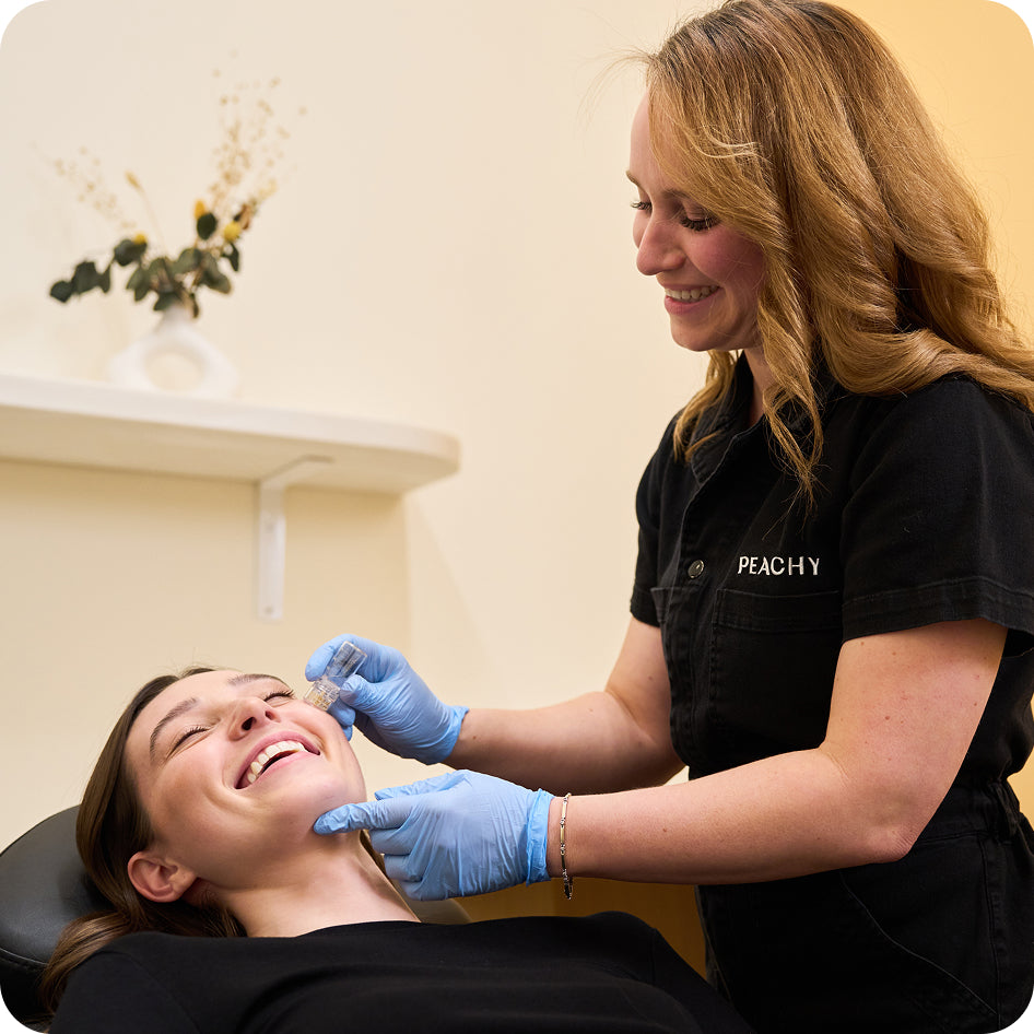 Botox treatment being applied to client's face