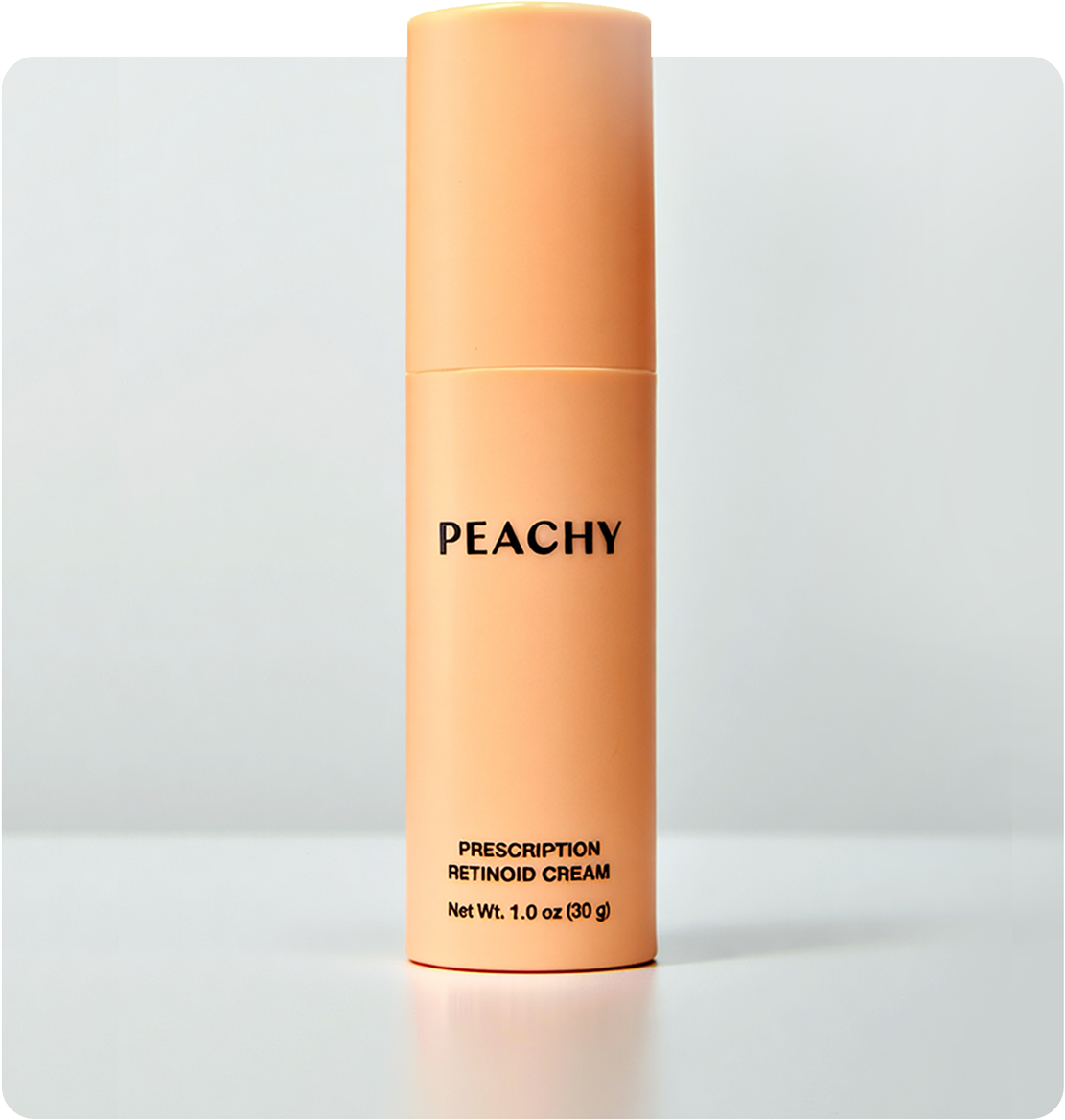 Peach-colored Peachy prescription retinoid cream bottle on a light gray background