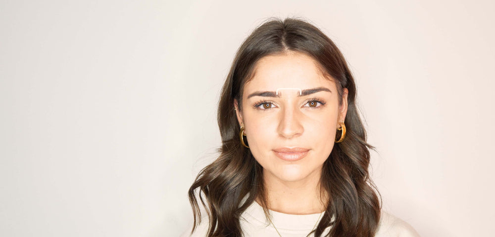 Eyebrow treatment area pointed out on face