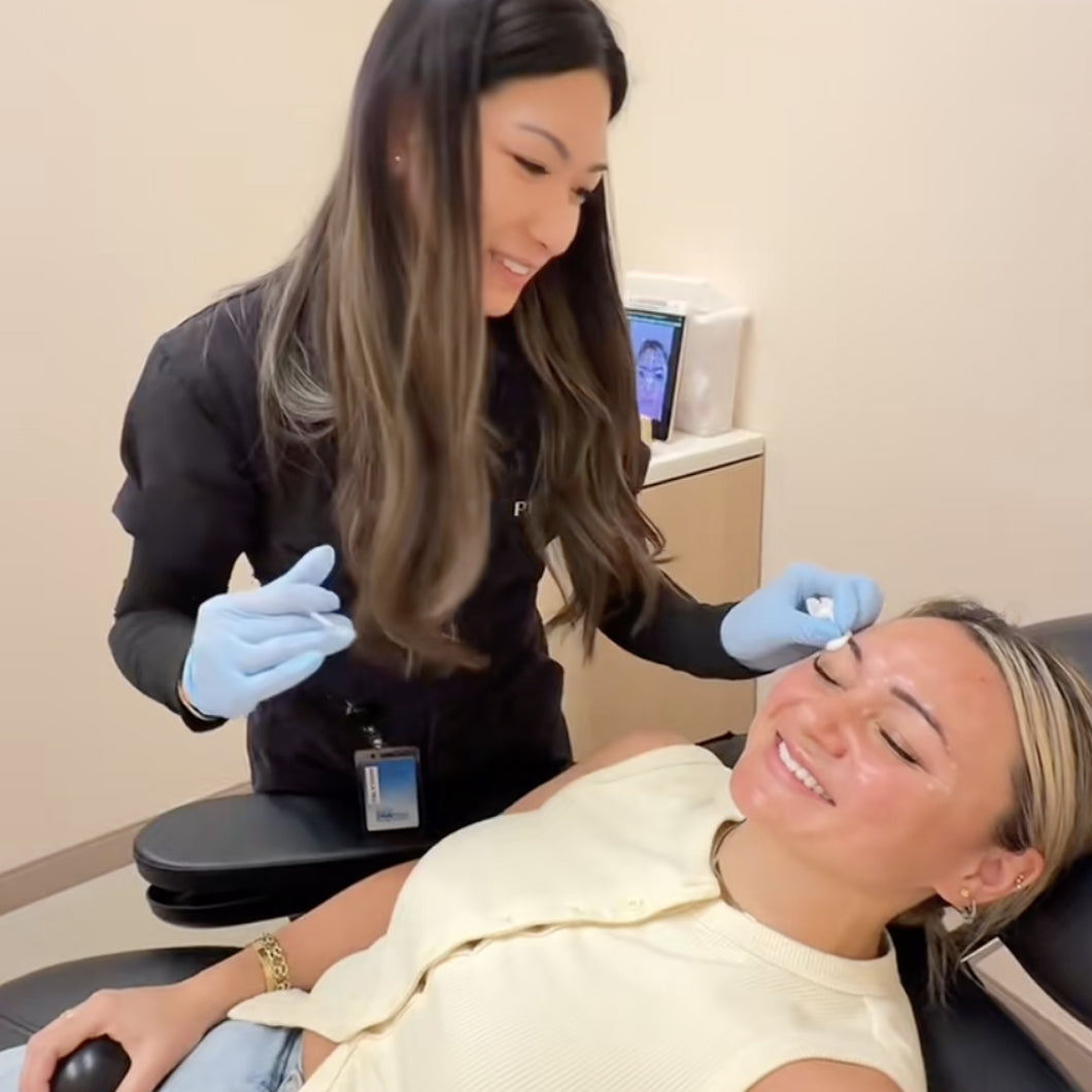 Peachy provider applying treatment to eyebrow