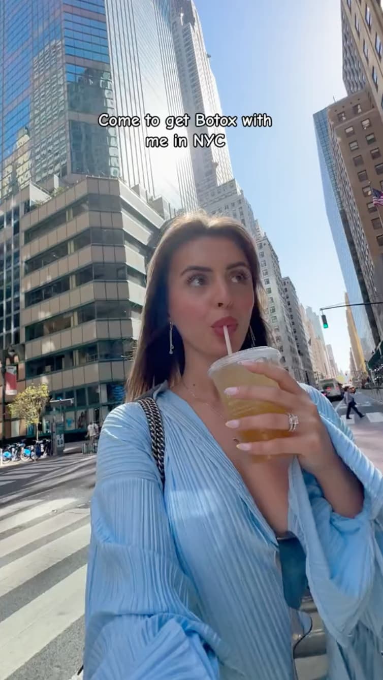 Woman with iced drink going to get botox