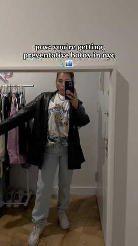 woman taking selfie in closet